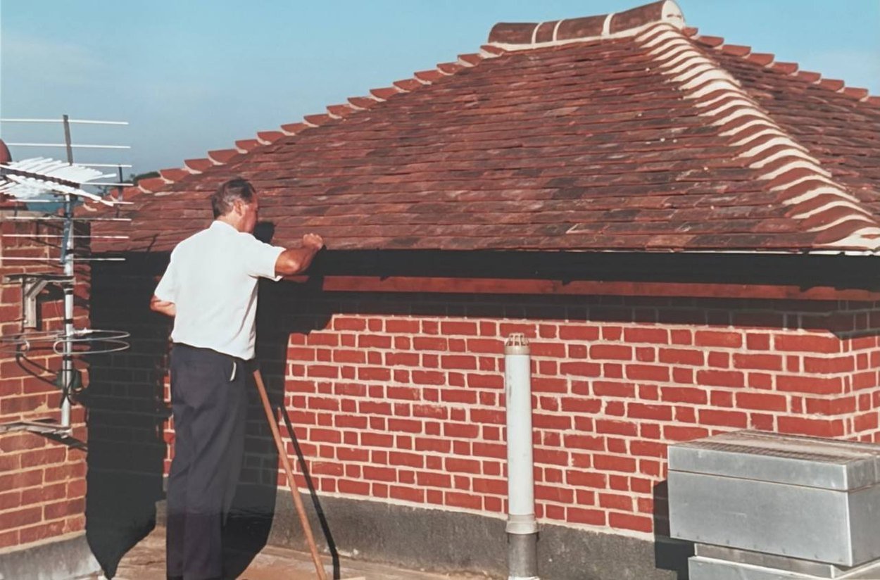 William Pocock on a roof in the early 2000s